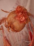 Ladies Coral with feathers Fascinator