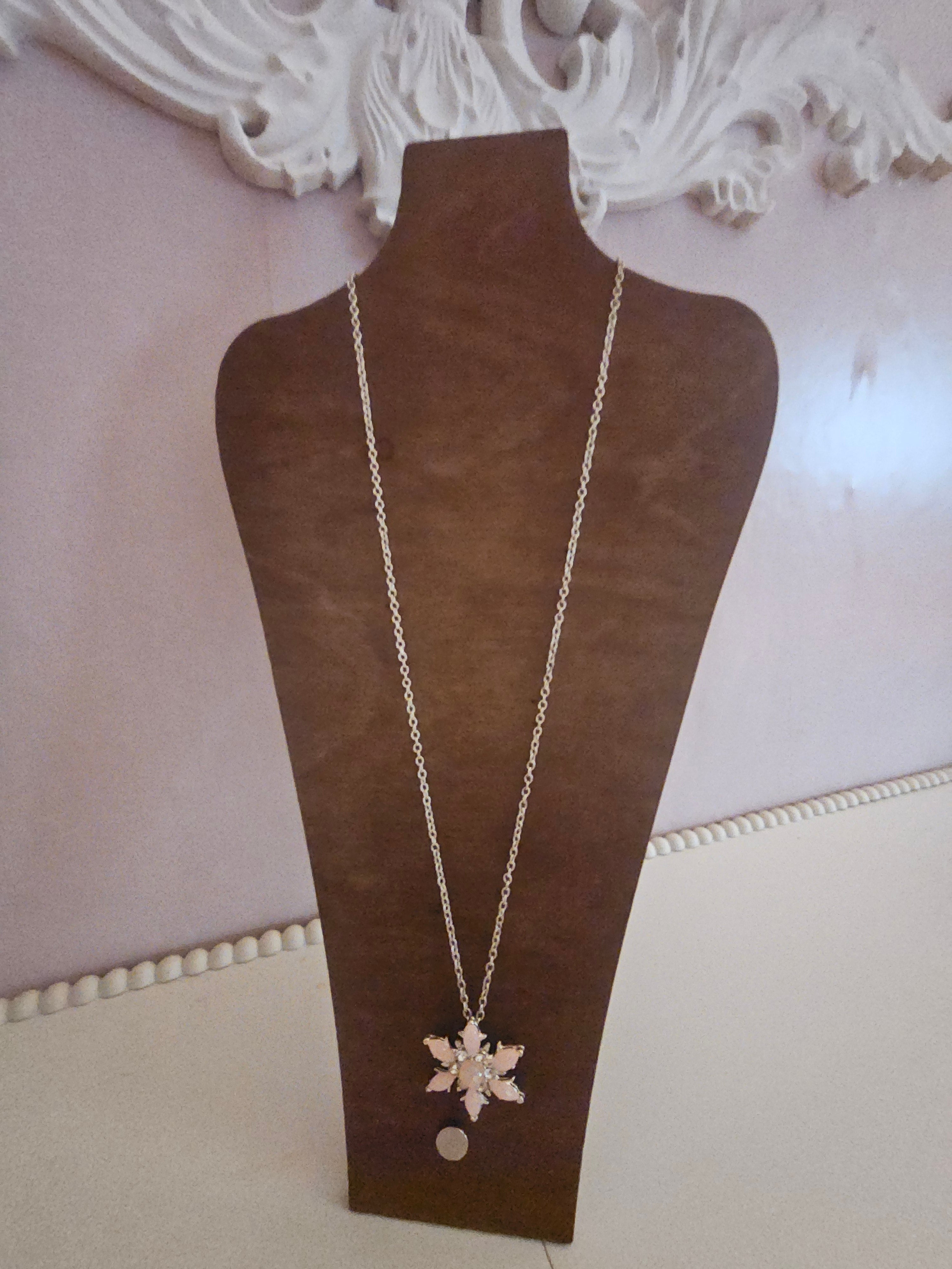 Ladies pink snowflake pendant on silver necklace