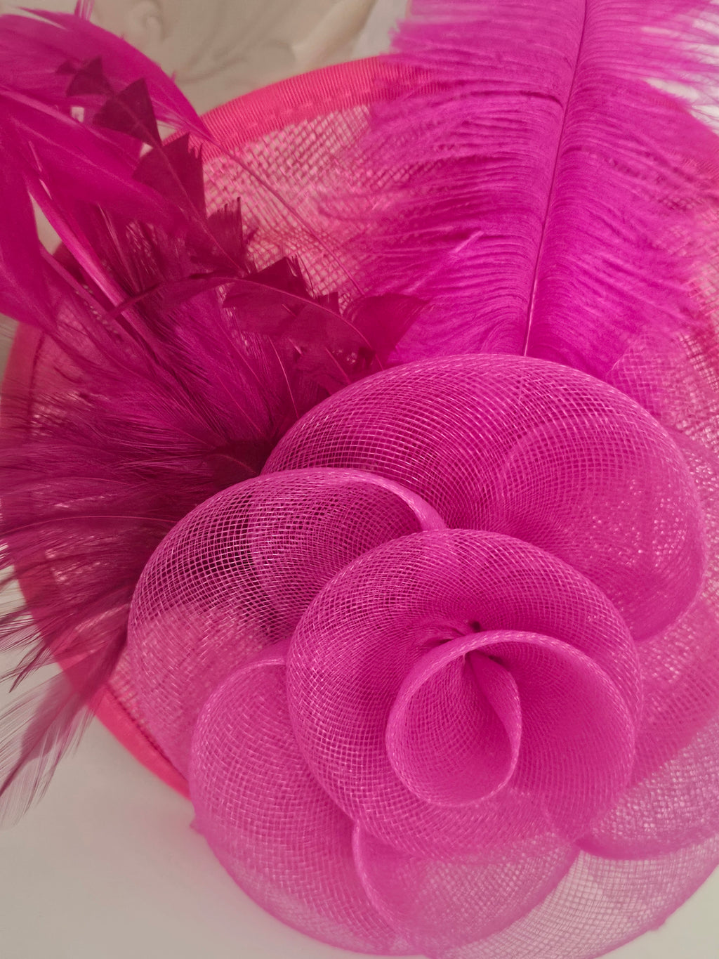 Ladies Pink fascinator with matching clutch bag