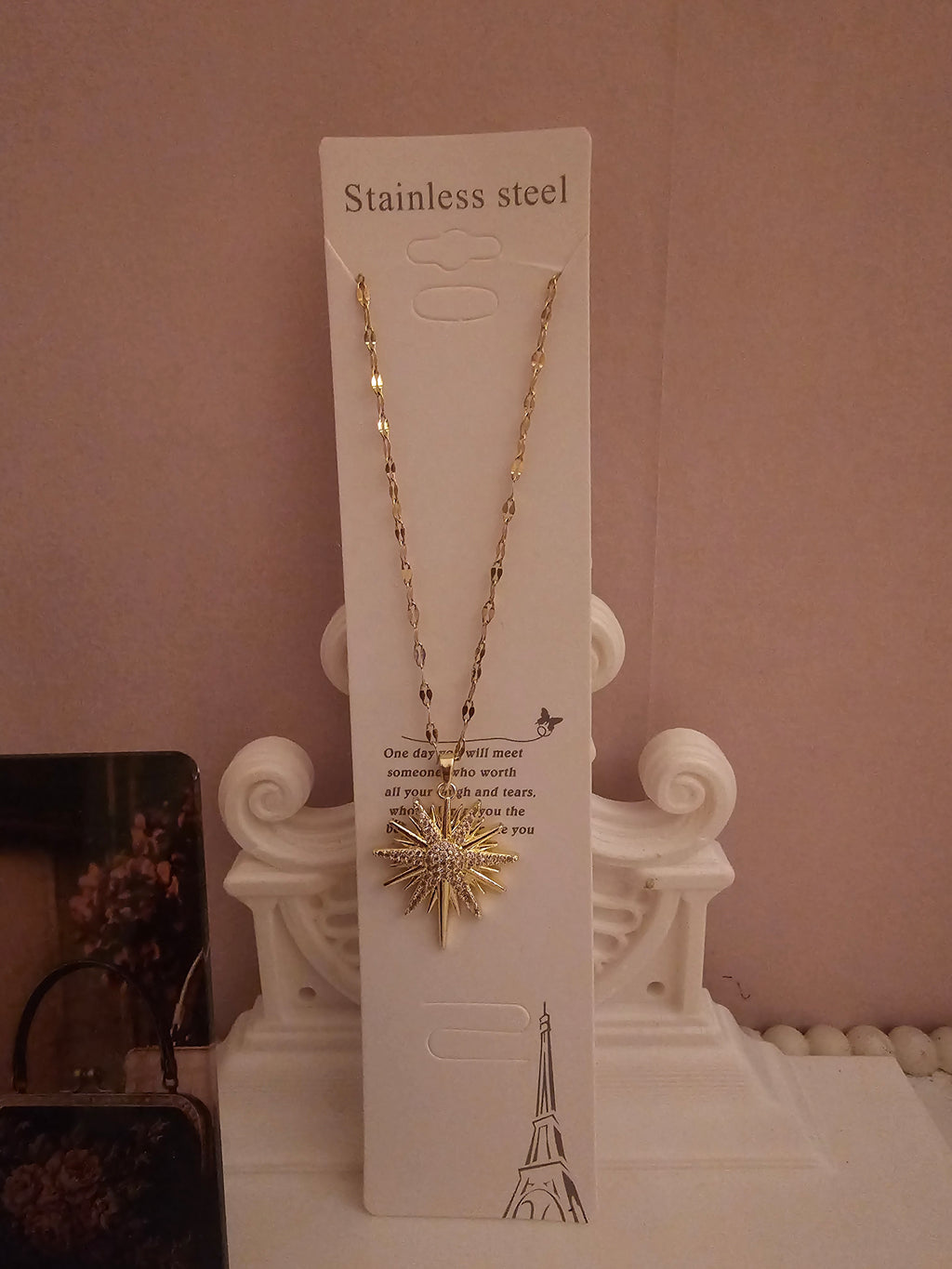 2 x gold necklace with 1 x star pendant 1 x starburst pendant