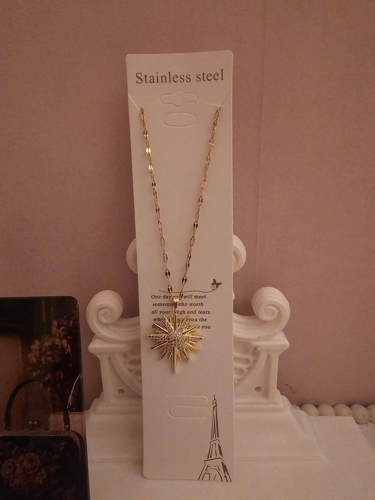 2 x gold necklace with 1 x star pendant 1 x starburst pendant