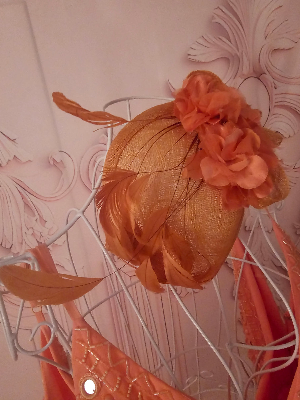 Ladies Coral with feathers Fascinator