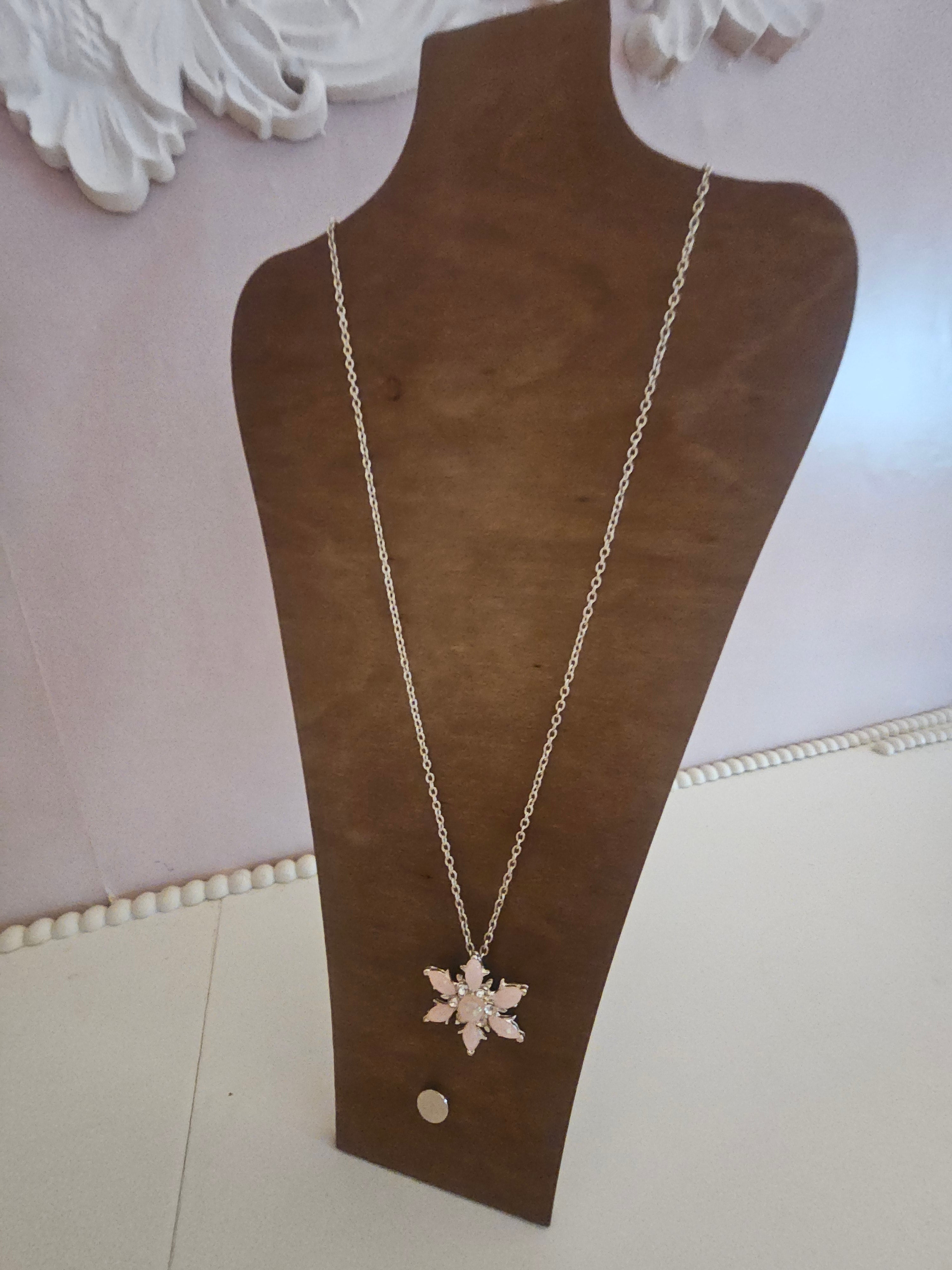 Ladies pink snowflake pendant on silver necklace