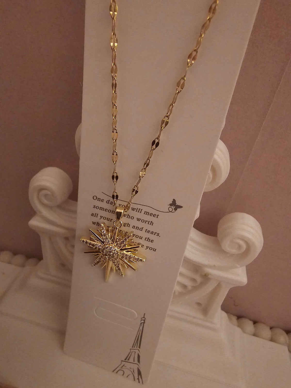 2 x gold necklace with 1 x star pendant 1 x starburst pendant
