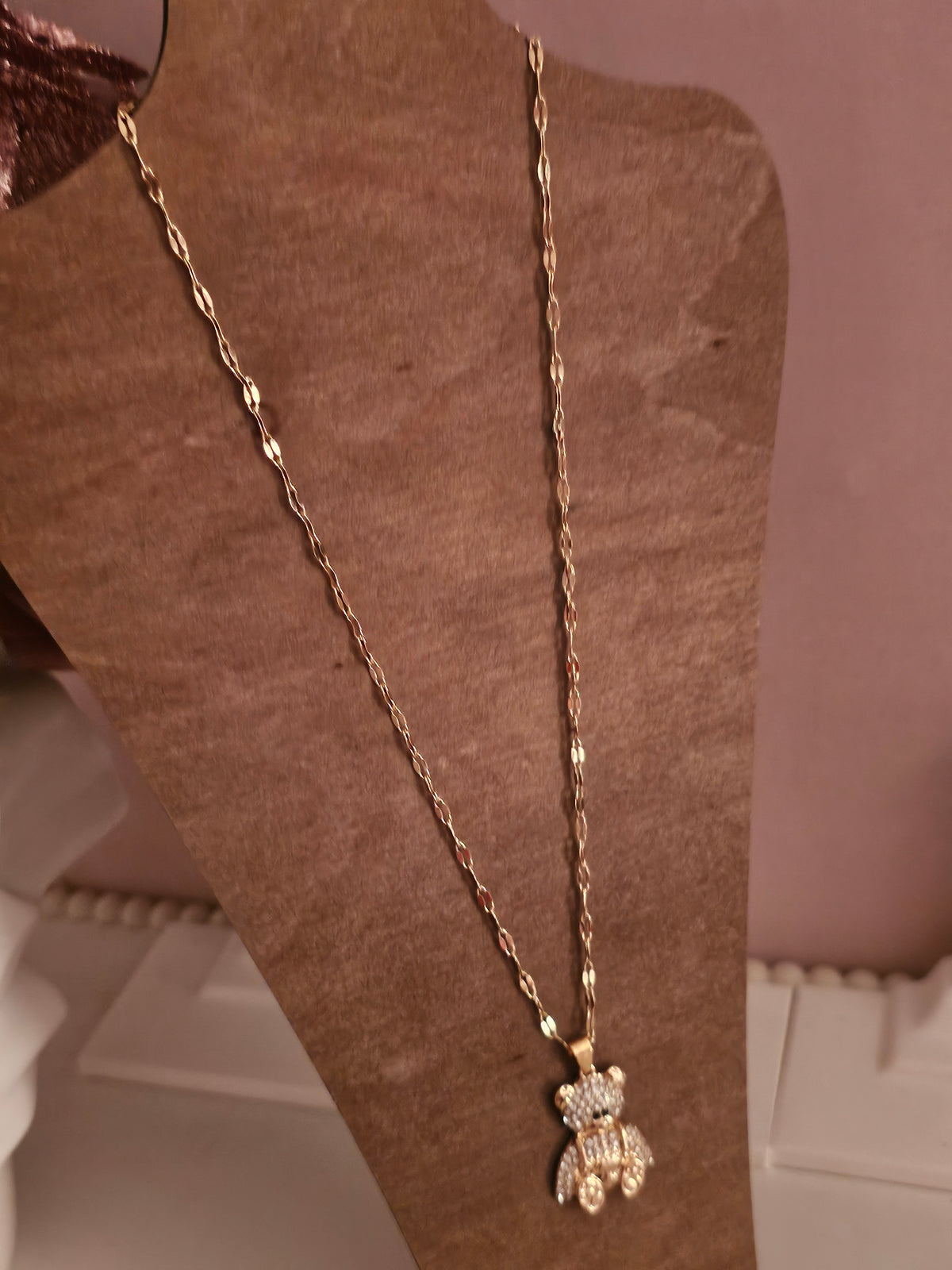 Gold necklace with diamond teddy bear pendant