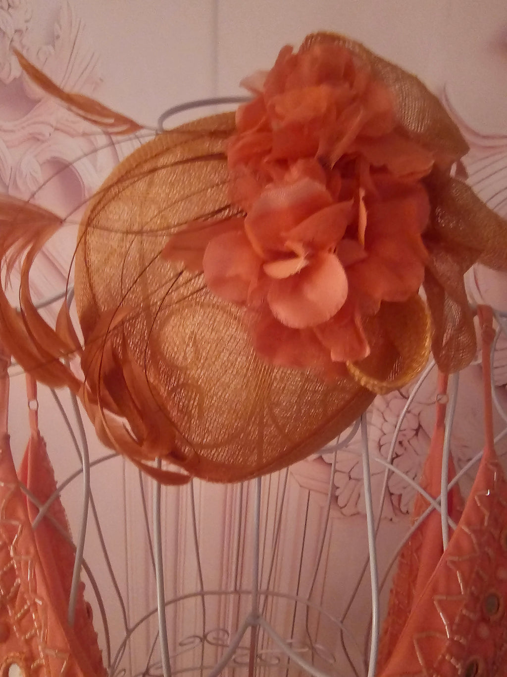 Ladies Coral with feathers Fascinator