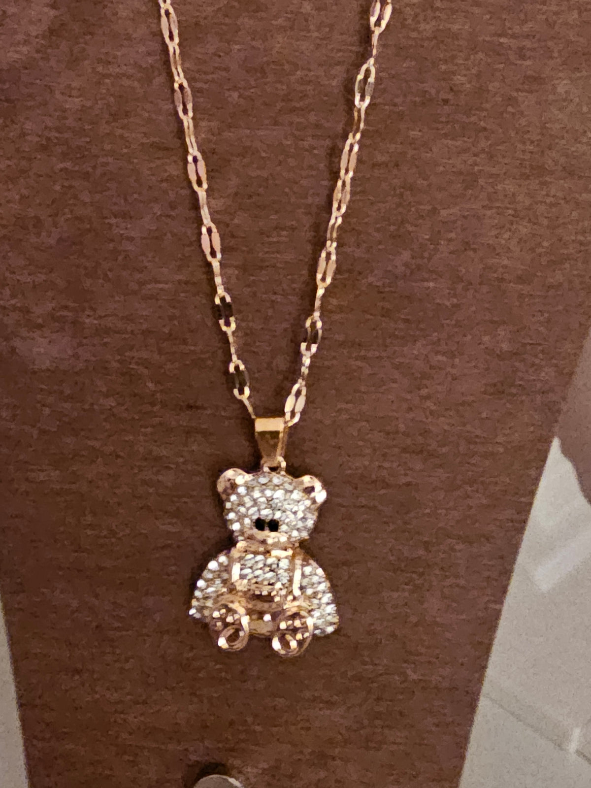 Gold necklace with diamond teddy bear pendant