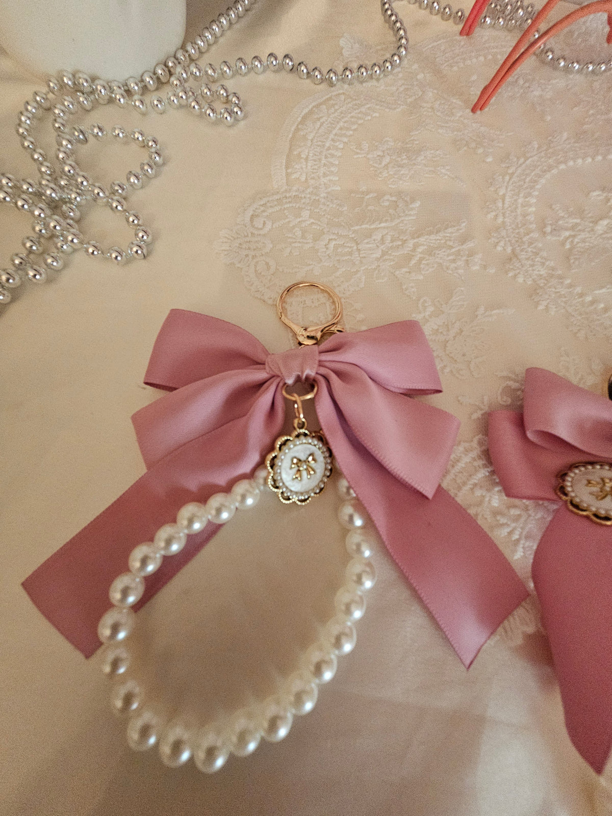 Ladies x 3 classy large pink bow with set of pearls keyrings and gold circle pendant