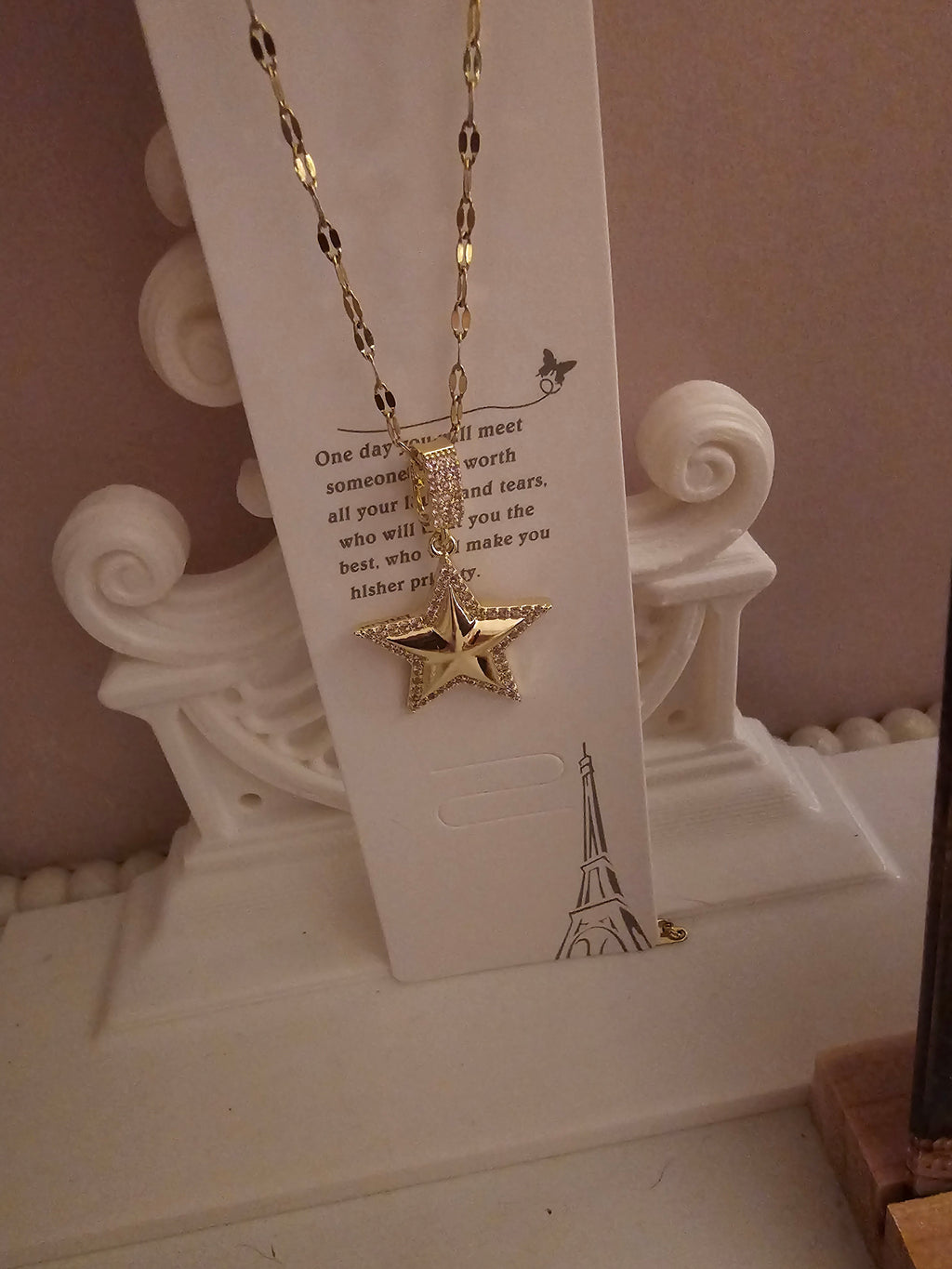 2 x gold necklace with 1 x star pendant 1 x starburst pendant