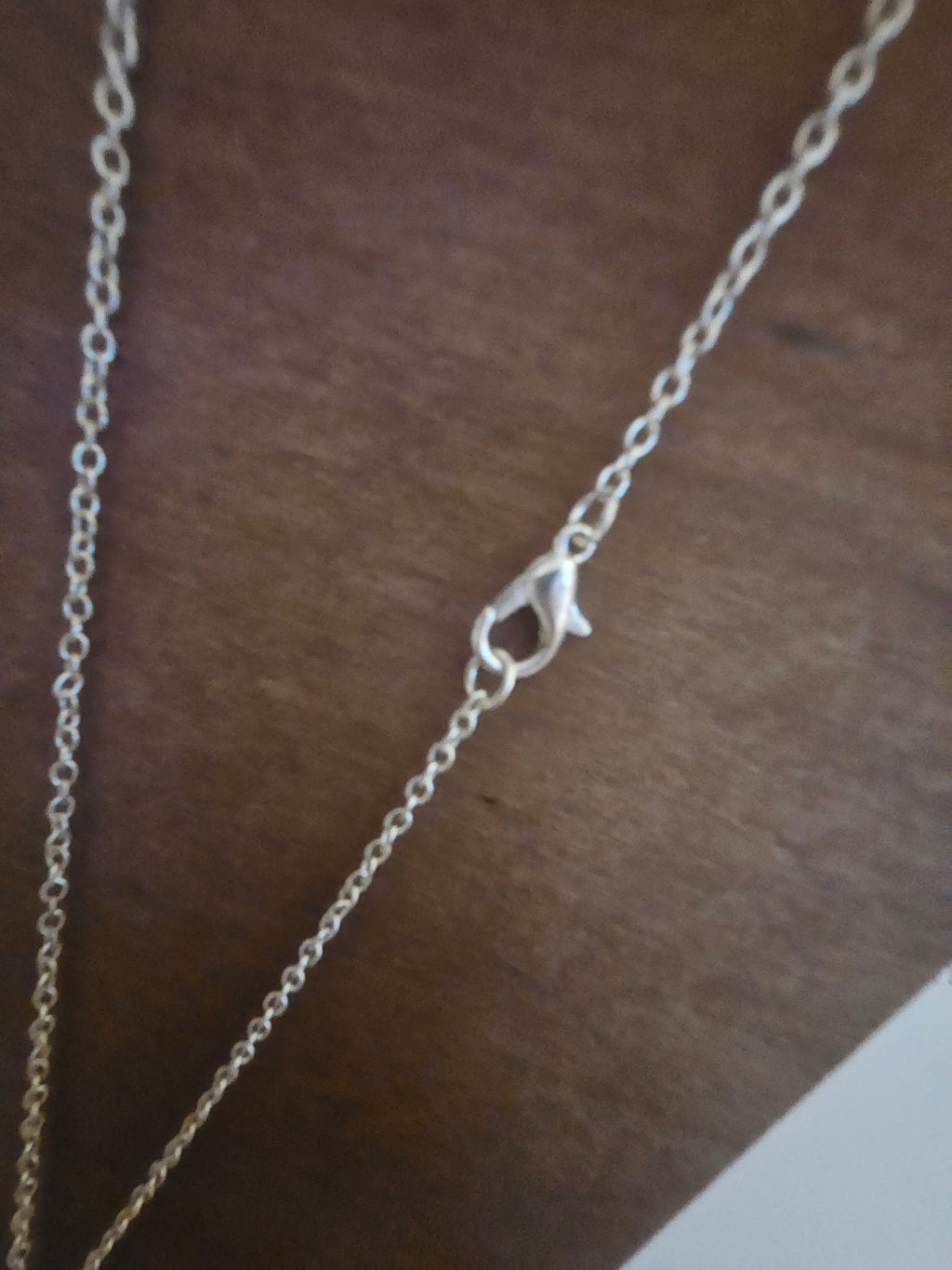 Ladies pink snowflake pendant on silver necklace