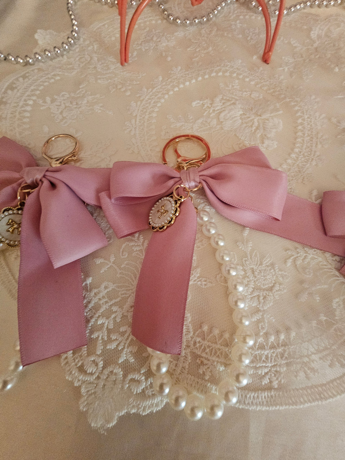 Ladies x 3 classy large pink bow with set of pearls keyrings and gold circle pendant