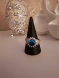 Ladies silver dress ring with blue sapphire stone setting design