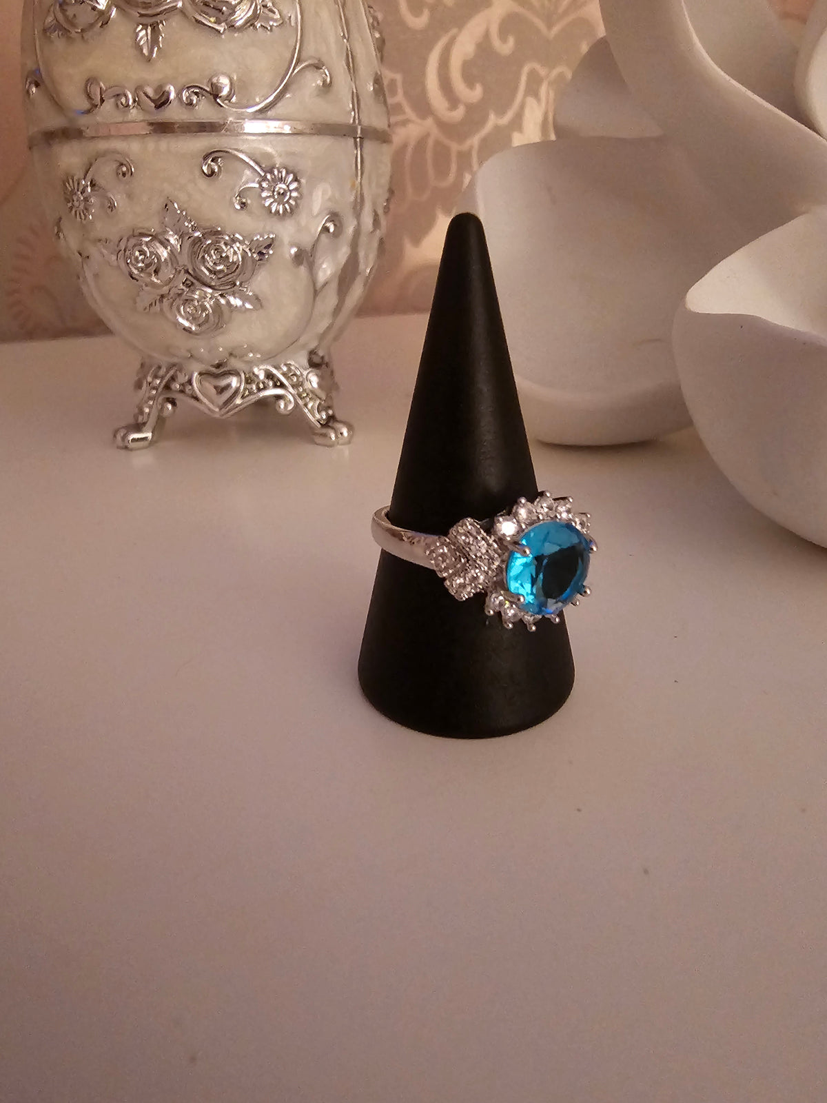 Ladies silver dress ring with blue sapphire stone setting design