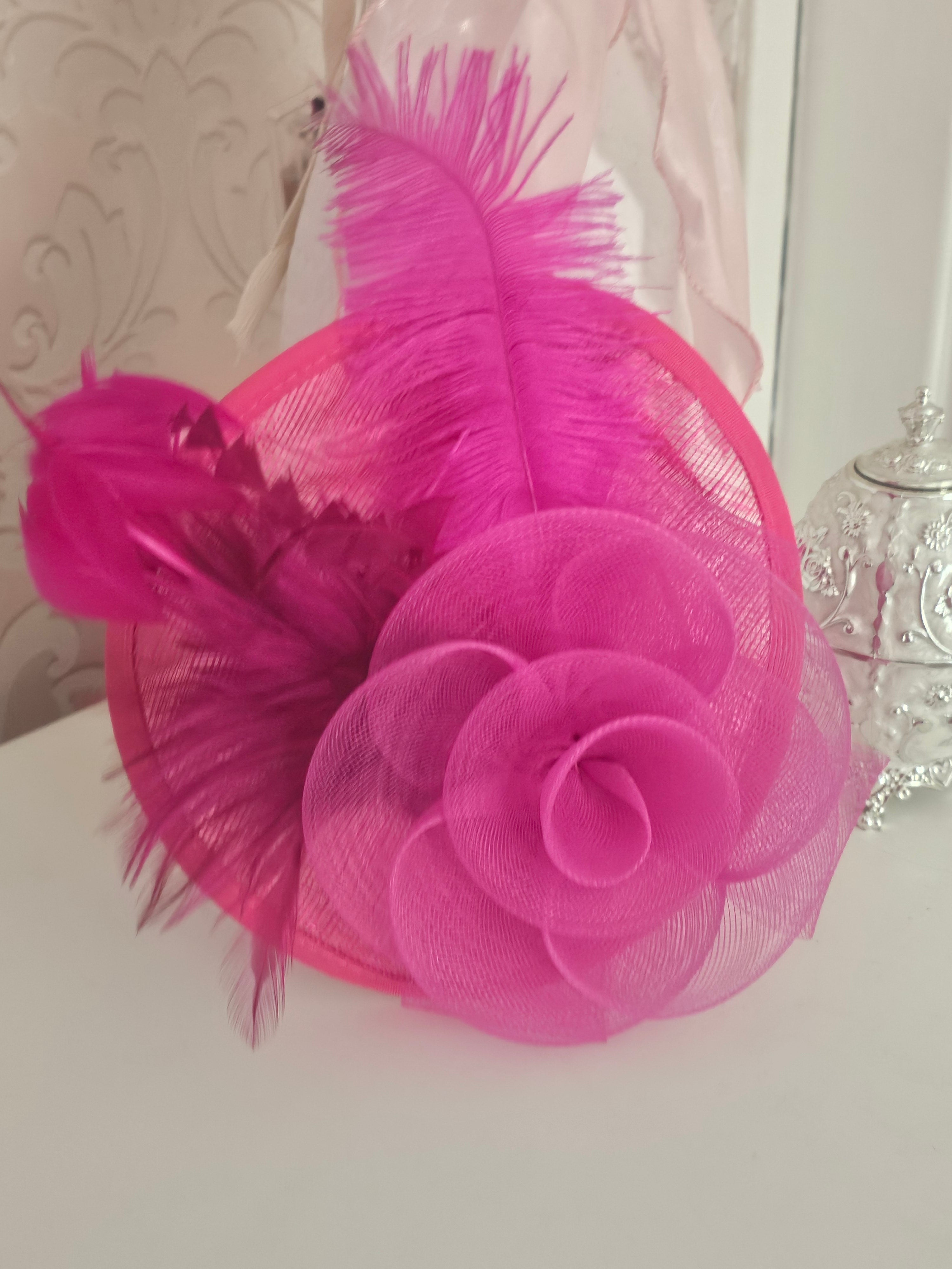Ladies Pink fascinator with matching clutch bag