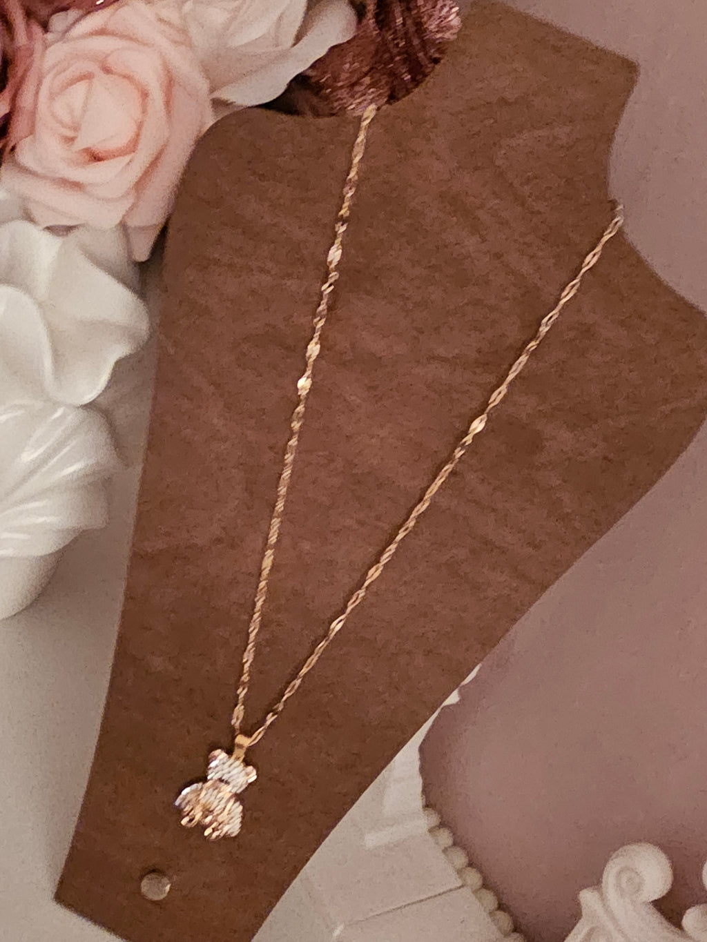 Gold necklace with diamond teddy bear pendant