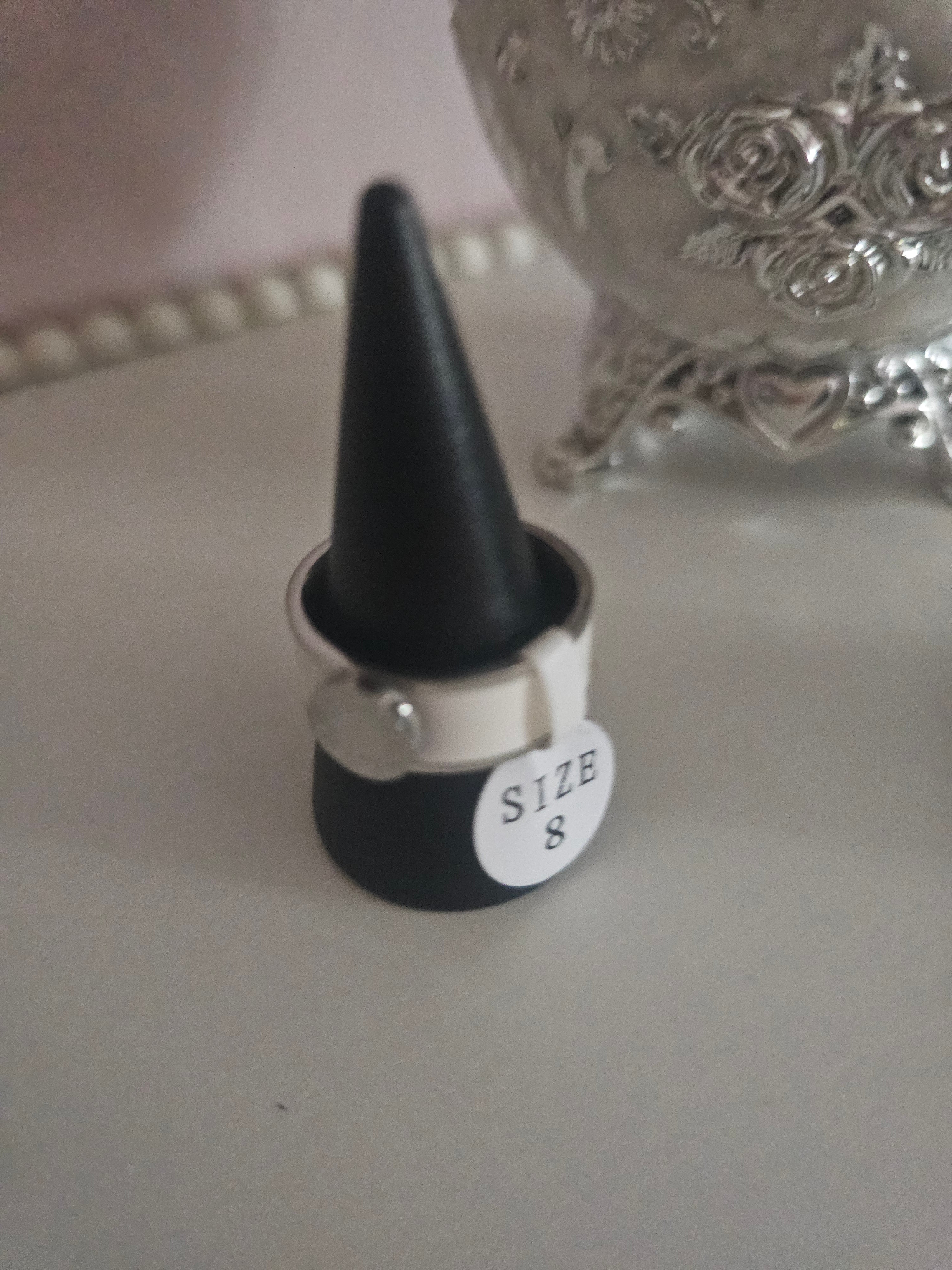 Ladies solid band rings, one white one silver size 8 £10 each