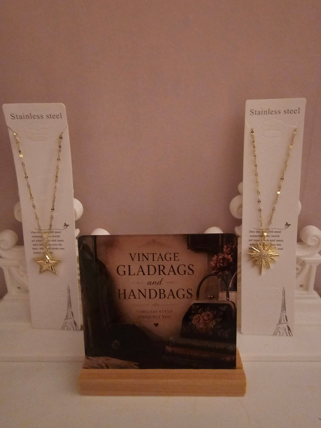 2 x gold necklace with 1 x star pendant 1 x starburst pendant