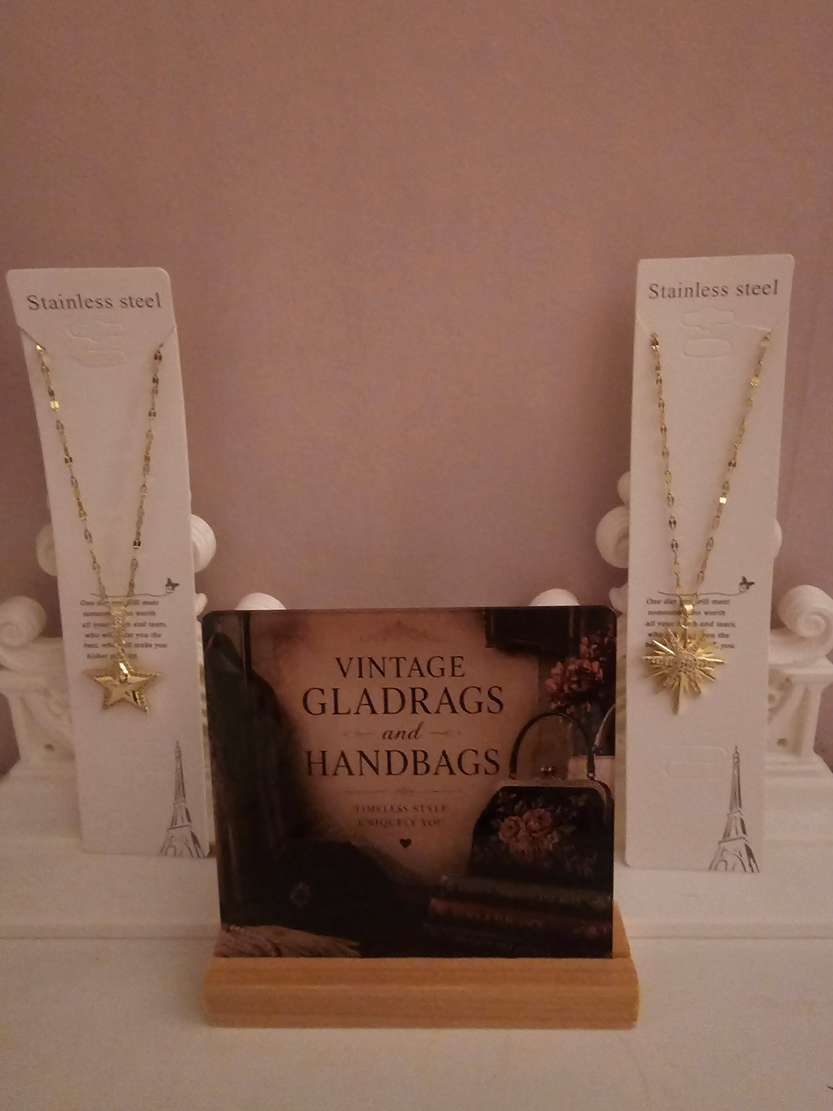 2 x gold necklace with 1 x star pendant 1 x starburst pendant