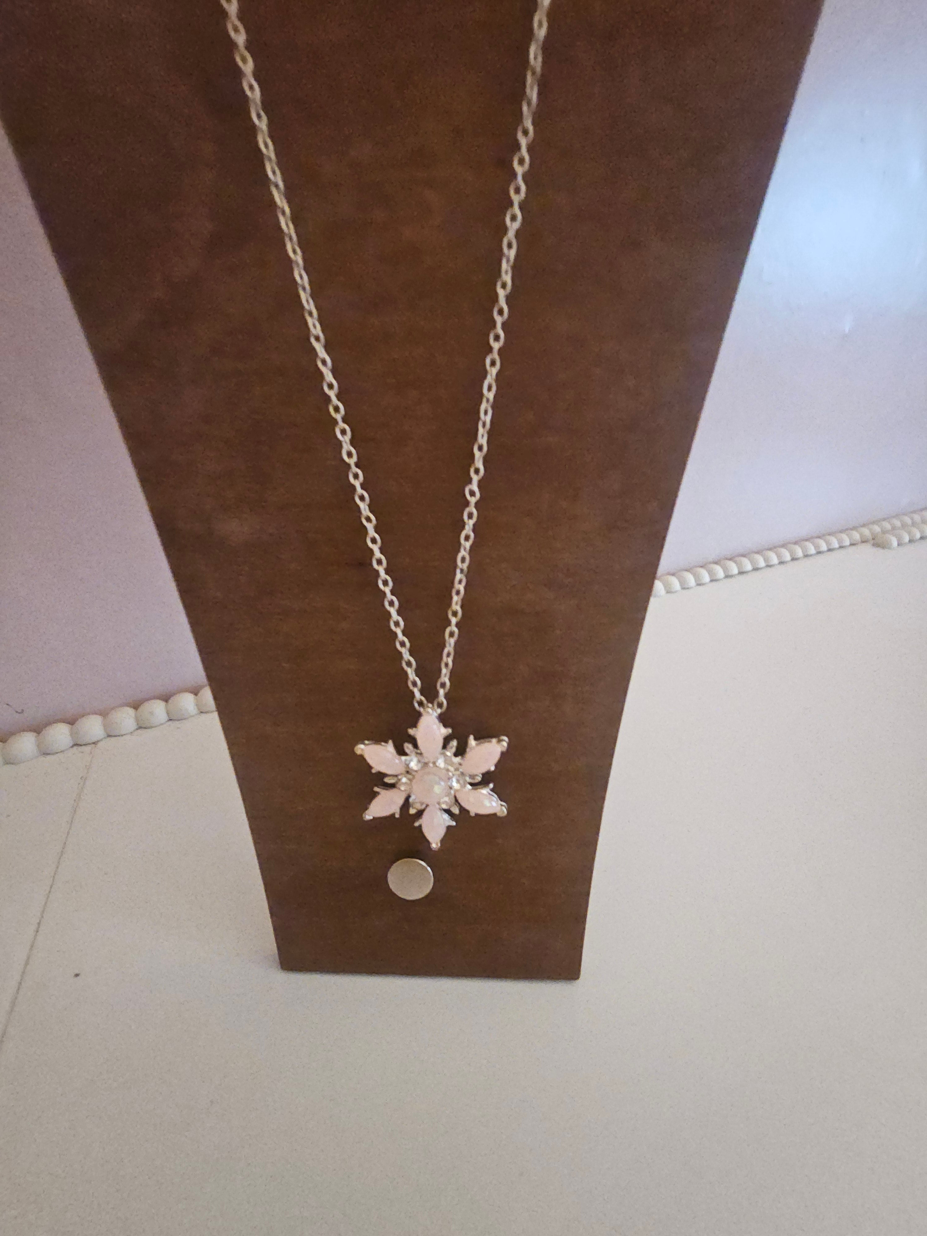 Ladies pink snowflake pendant on silver necklace