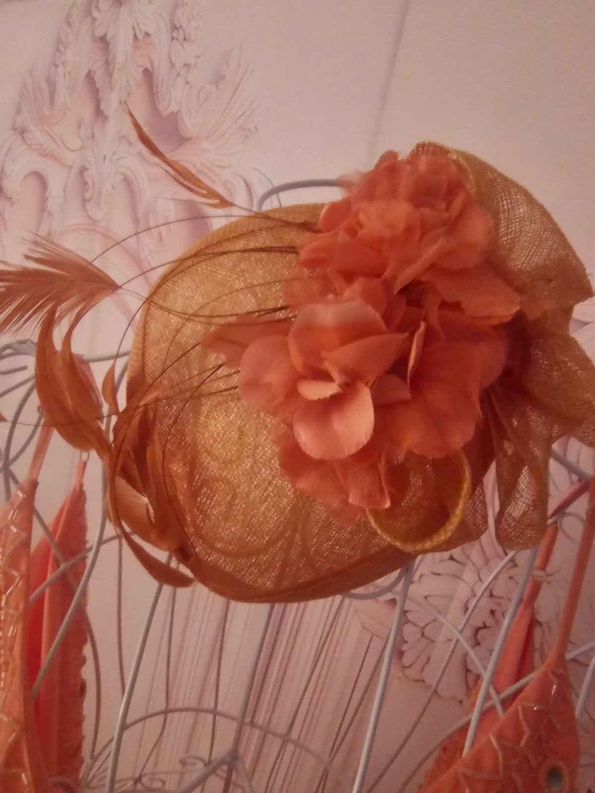 Ladies Coral with feathers Fascinator