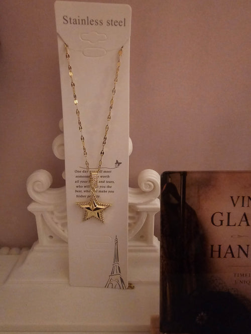 2 x gold necklace with 1 x star pendant 1 x starburst pendant