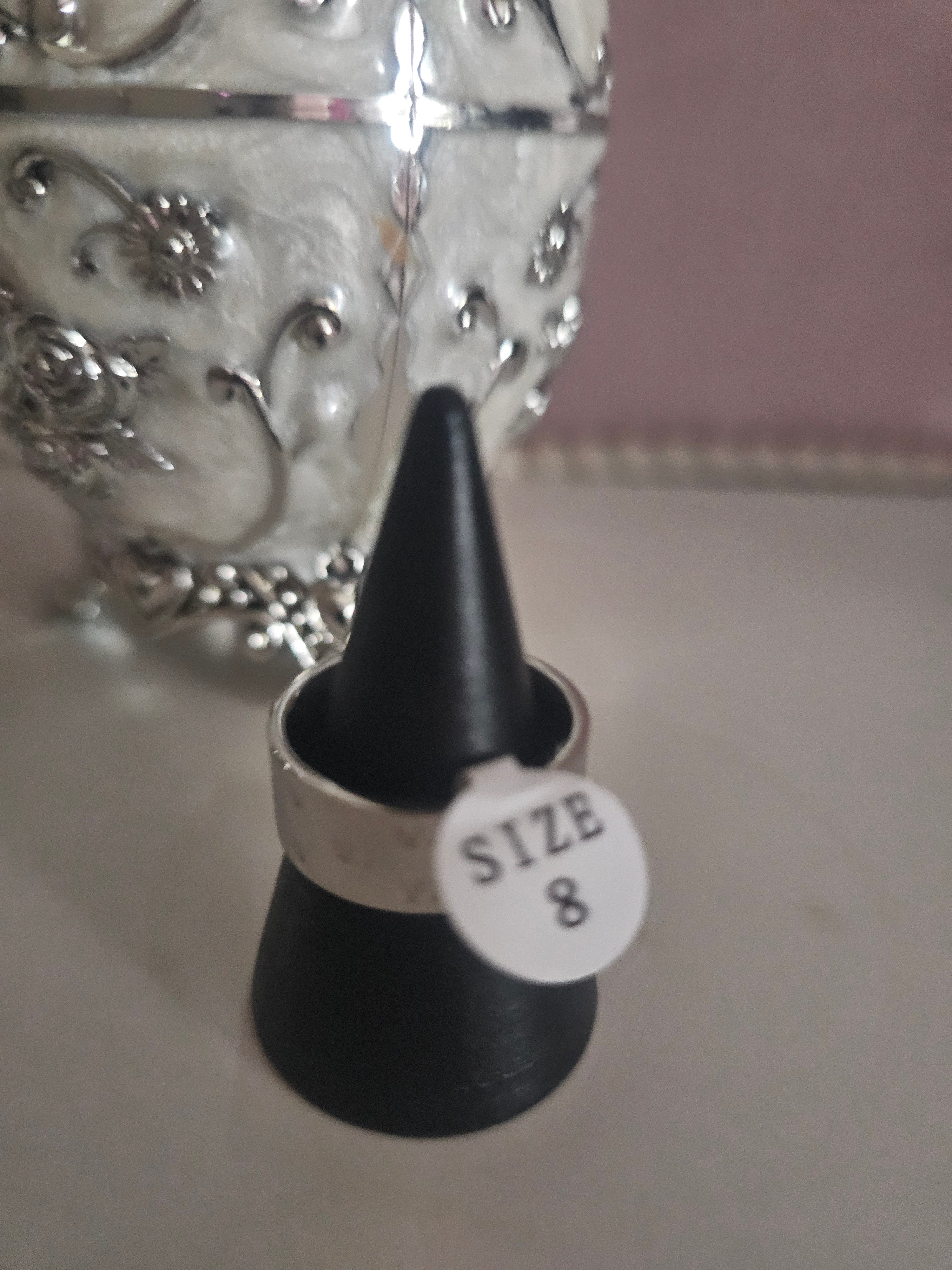 Ladies solid band rings, one white one silver size 8 £10 each